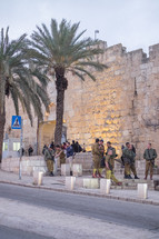soldiers in front of a wall in Jerusalem 