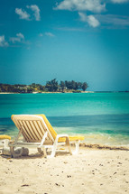 lounge chair on a beach 