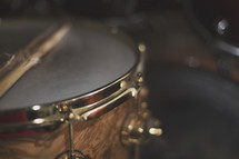 a close up of a snare drum and well used sticks