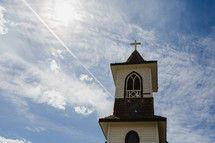 old wooden church steeple with cross