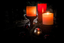 three Christmas candles 