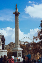 Nelson's Column, Trafalgar Square London with the London Eye in the background
