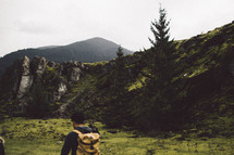 a man backpacking outdoors