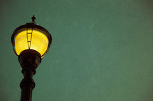lit lamppost looking from below