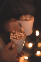 a couple drinking hot cocoa together 