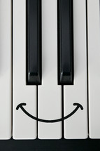 piano keys with a smiley face 