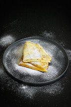 Breakfast Pancakes with Sugar on Black Background