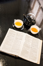 tea and an open Bible 