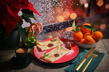 Crepes formed into envelopes in Christmas scene