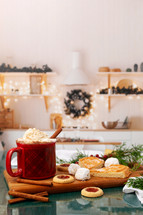 Hot Chocolate and Christmas Cookies with a Kitchen Background