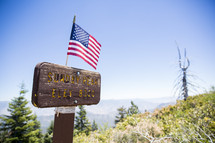 American flag on a sign for Sunday Peak 