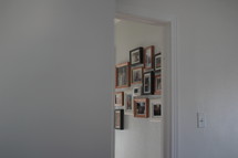 framed photos on a display wall 