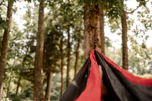a person resting in a hammock