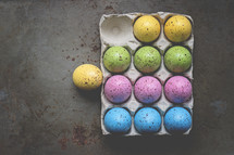 speckled Easter eggs in a carton 