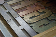 letters on a metal press 