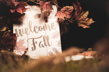 Welcome Fall sign and Bible in grass