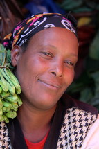 Face of a woman in an African market  [For similar search Ethnic Face Smile]