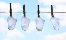 socks drying on a clothesline 