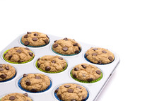 chocolate chip muffins in a baking tin