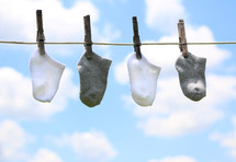 socks drying on a clothesline 