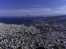 aerial view over a densely populated coastal community 