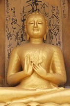 golden praying Buddha 