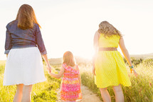 mother and daughters walking together