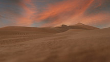 colorful pink clouds over sand dunes 