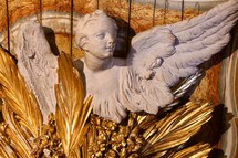 angel statue with golden feathers 