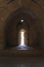 sunlight through a window in ruins at an historic site in Jordan 