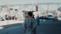 a woman walking down a closed off street 