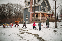 kids playing outdoors in snow 