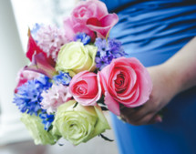Bridesmaid holding bouquet of flowers