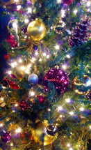 Christmas tree decorations Christmas tree ornaments and lights lighting up a Christmas Tree. 