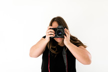 a woman holding a camera 
