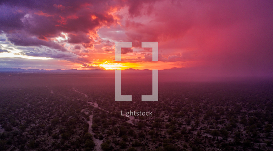 Aerial sunset after a storm in the desert