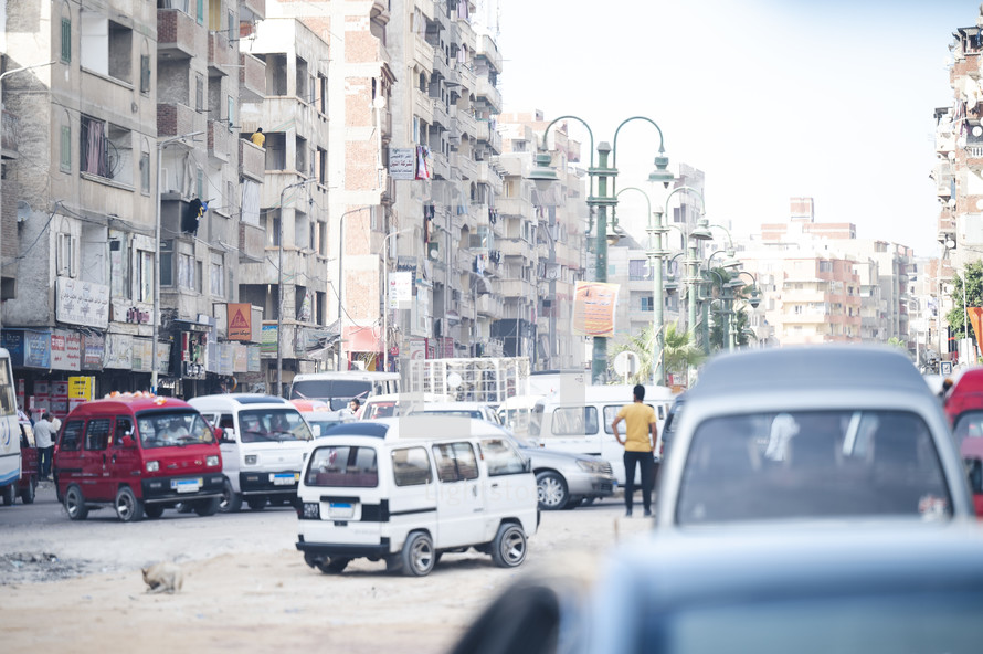 traffic on rugged street in a city in Egypt 