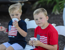 boys eating snow cones on the Fourth of July 