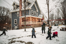 kids playing outdoors in snow 