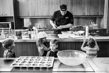 children at cooking glass 