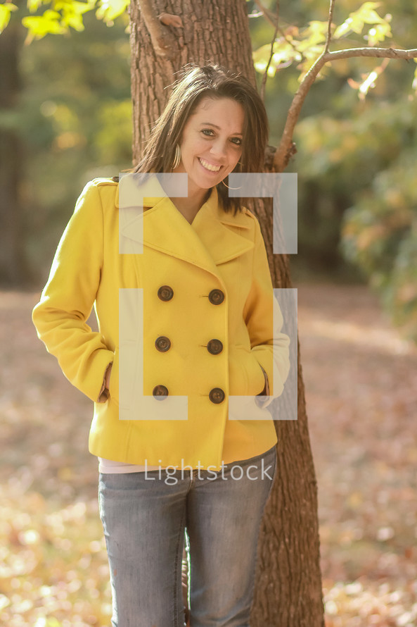 smiling woman standing outdoors 
