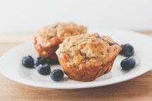 blueberry muffins on a plate 