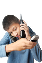 a kid talking on three phones 