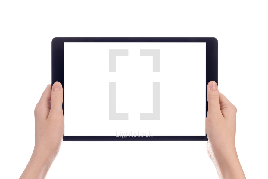 Hands holding a tablet computer with white screen.