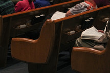 people sitting in pews during a worship service 