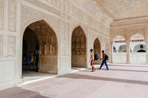 people entering a mosque