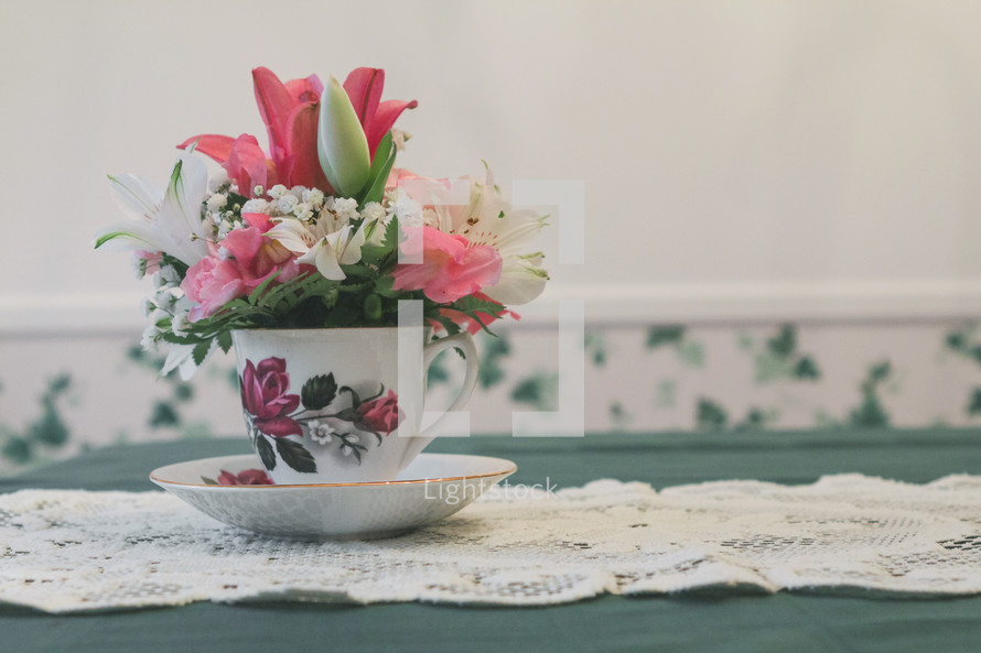 flower arrangement in a tea cup 