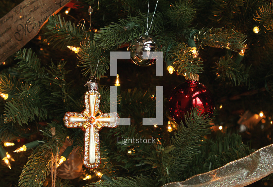 cross ornament on a Christmas tree 