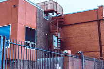 spiral staircase on the side of a building 