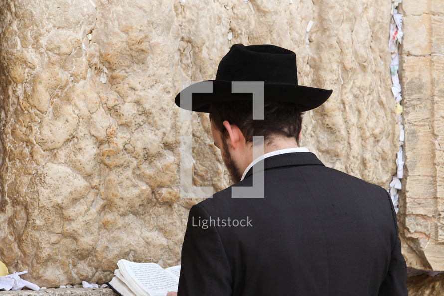 A man praying at the Western wall 